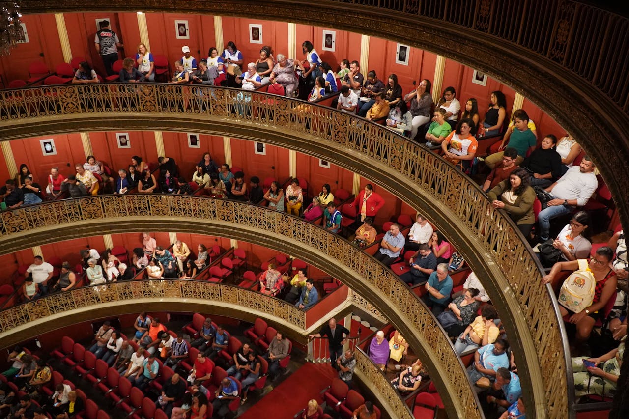 View of audience in Teatro Santa Isabel, Recife, showcasing its elegant architecture and engaged spectators.